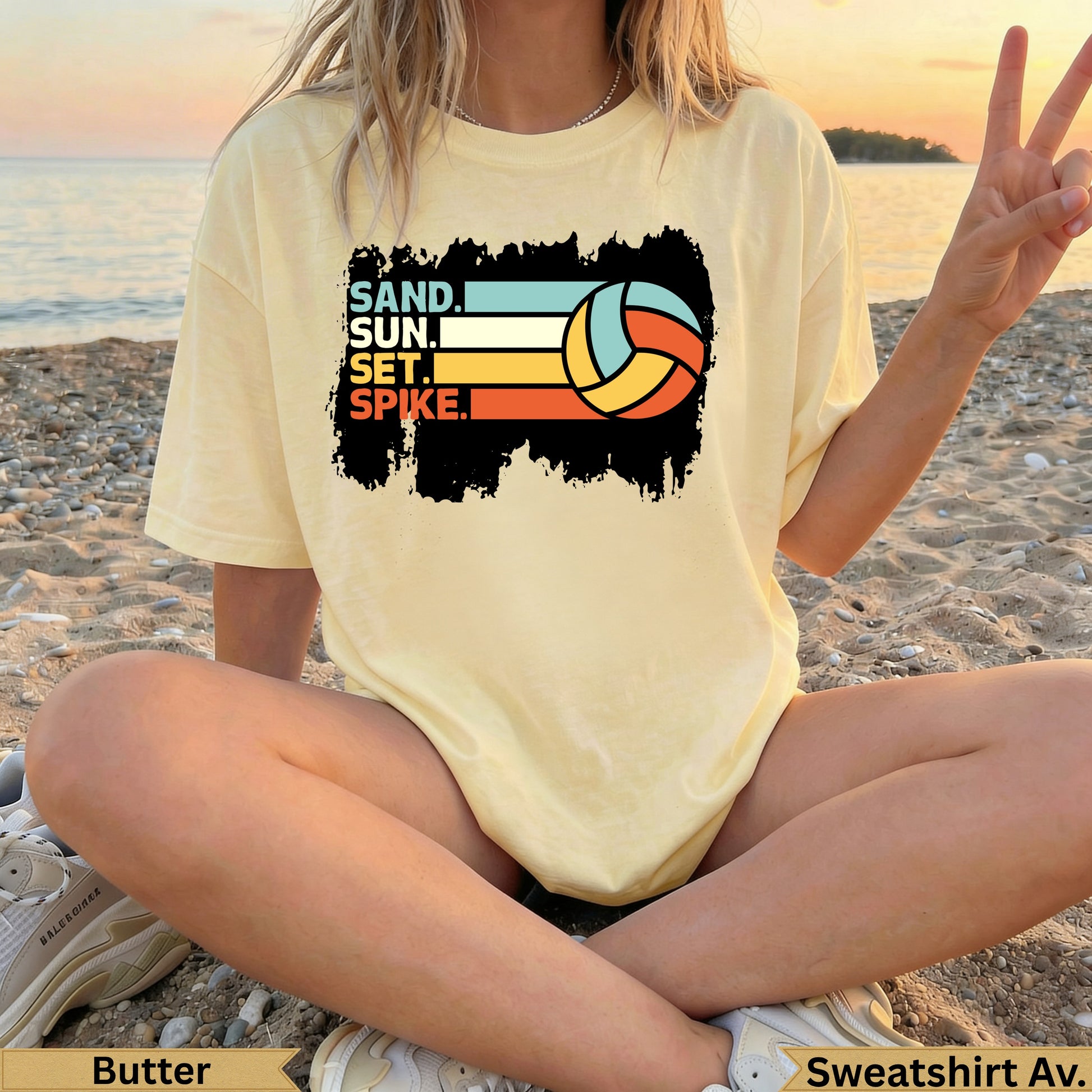 Yellow t-shirt with "SAND. SUN. SET. SPIKE." and volleyball graphic.