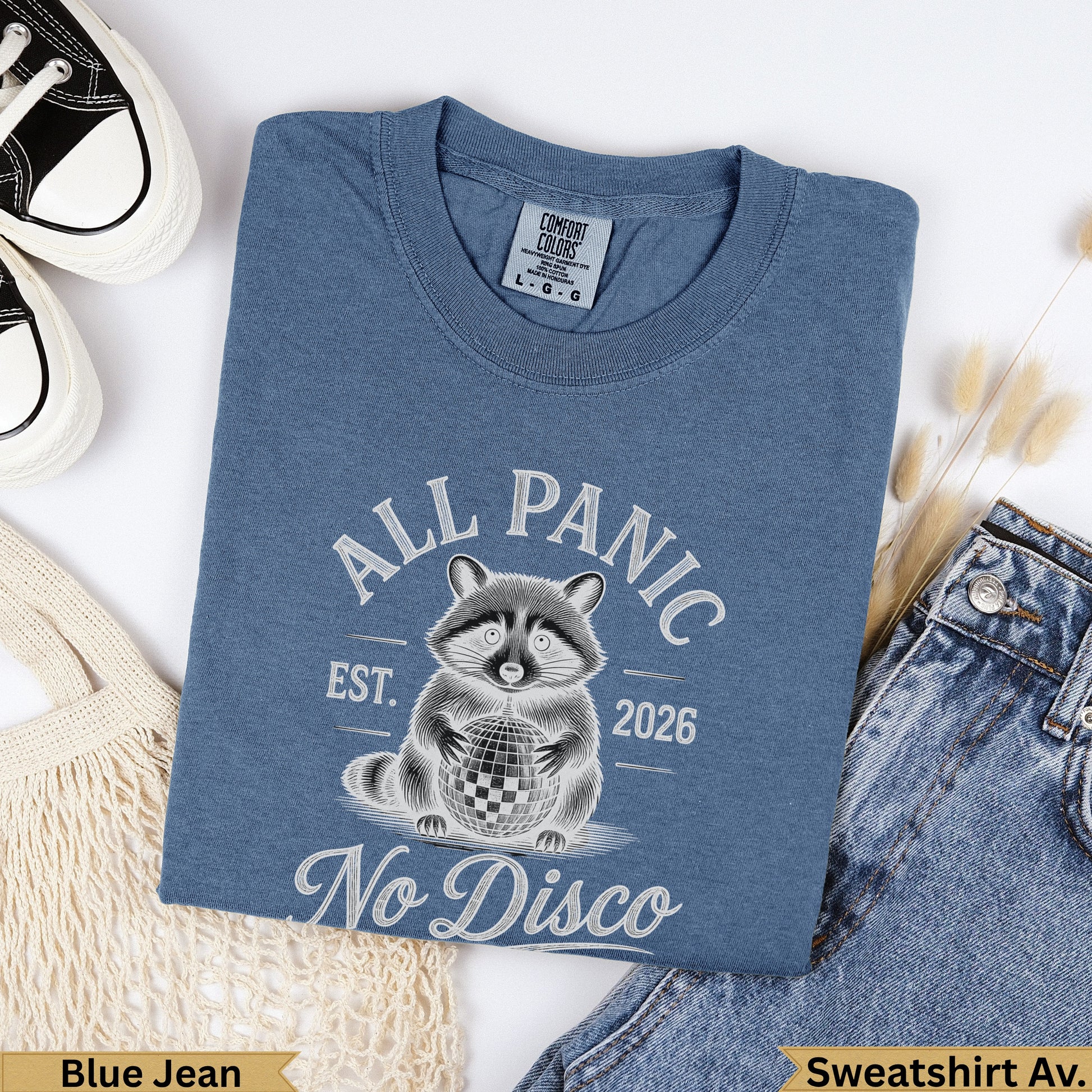 Blue Jean Comfort Colors sweatshirt with raccoon and "All Panic No Disco" text.