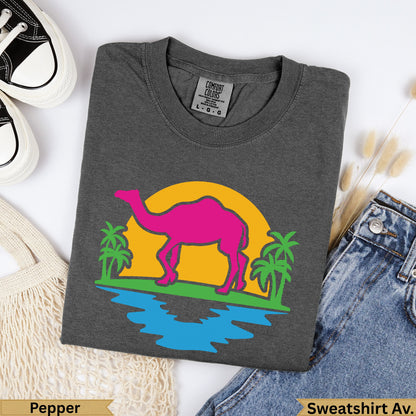 Dark gray t-shirt with pink camel, sun, and palm tree graphic.