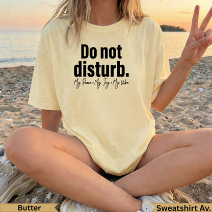 Yellow sweatshirt with "Do not disturb. My Peace • My Joy • My Vibe" text.