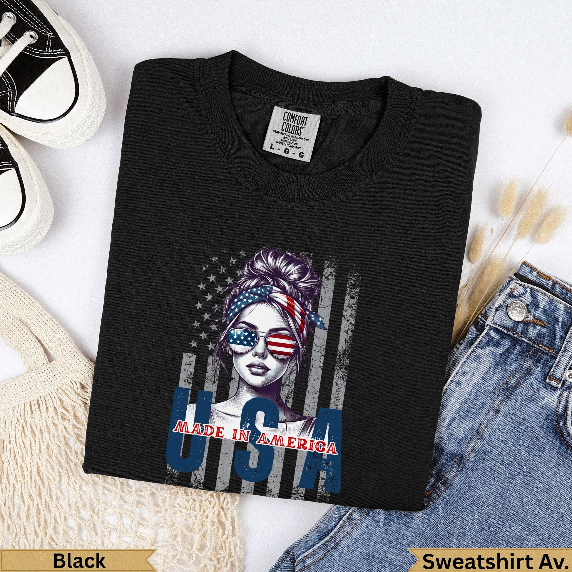 Black t-shirt with "Made in America" text and a woman wearing American flag sunglasses.