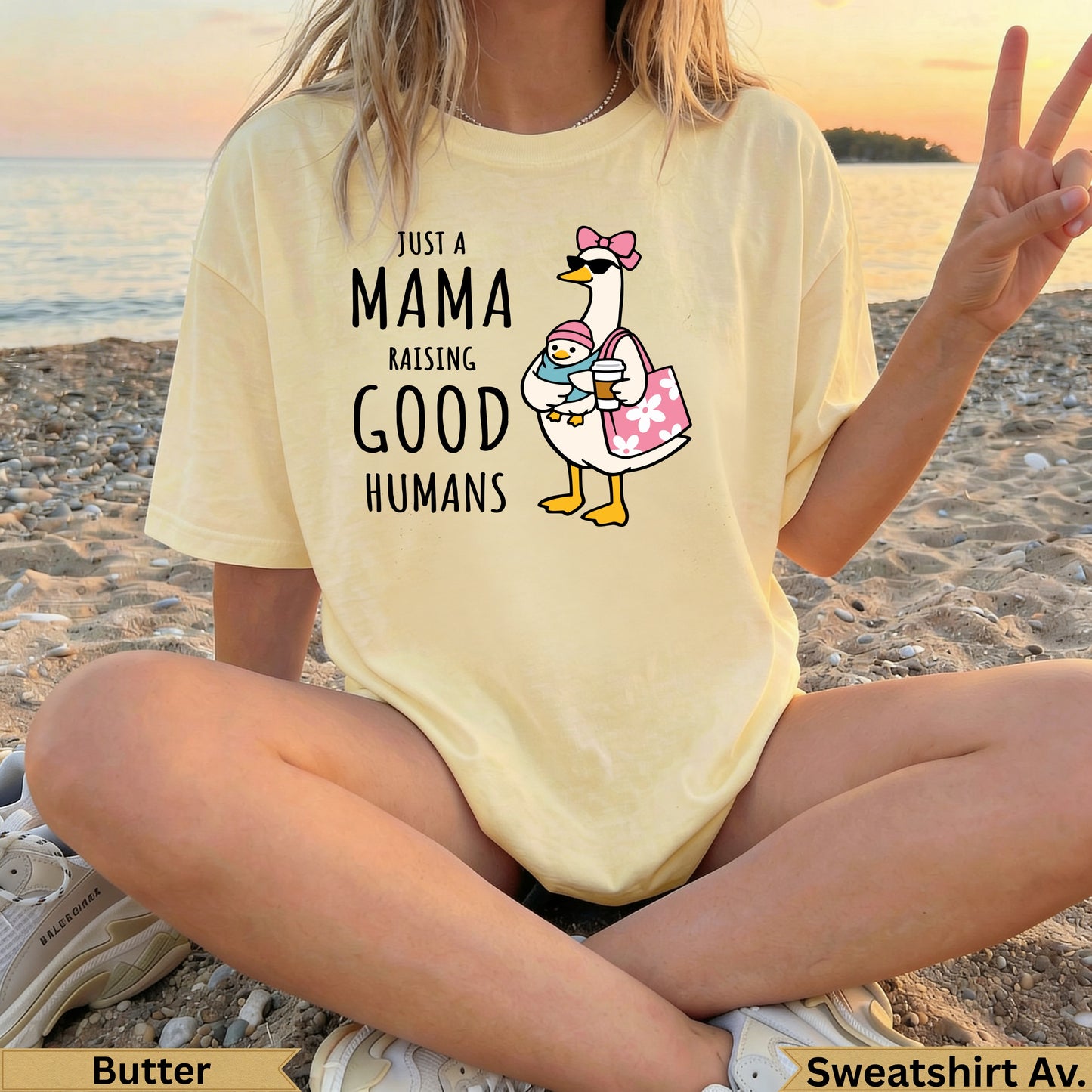 Yellow t-shirt with "Just a Mama Raising Good Humans" graphic of a duck and chick.