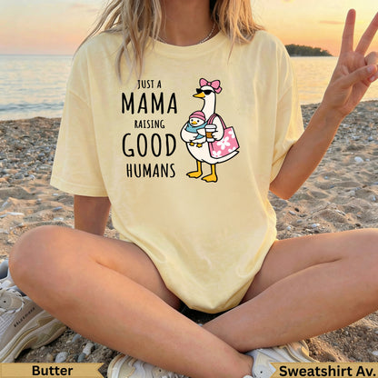 Yellow t-shirt with "Just a Mama Raising Good Humans" graphic of a duck and chick.