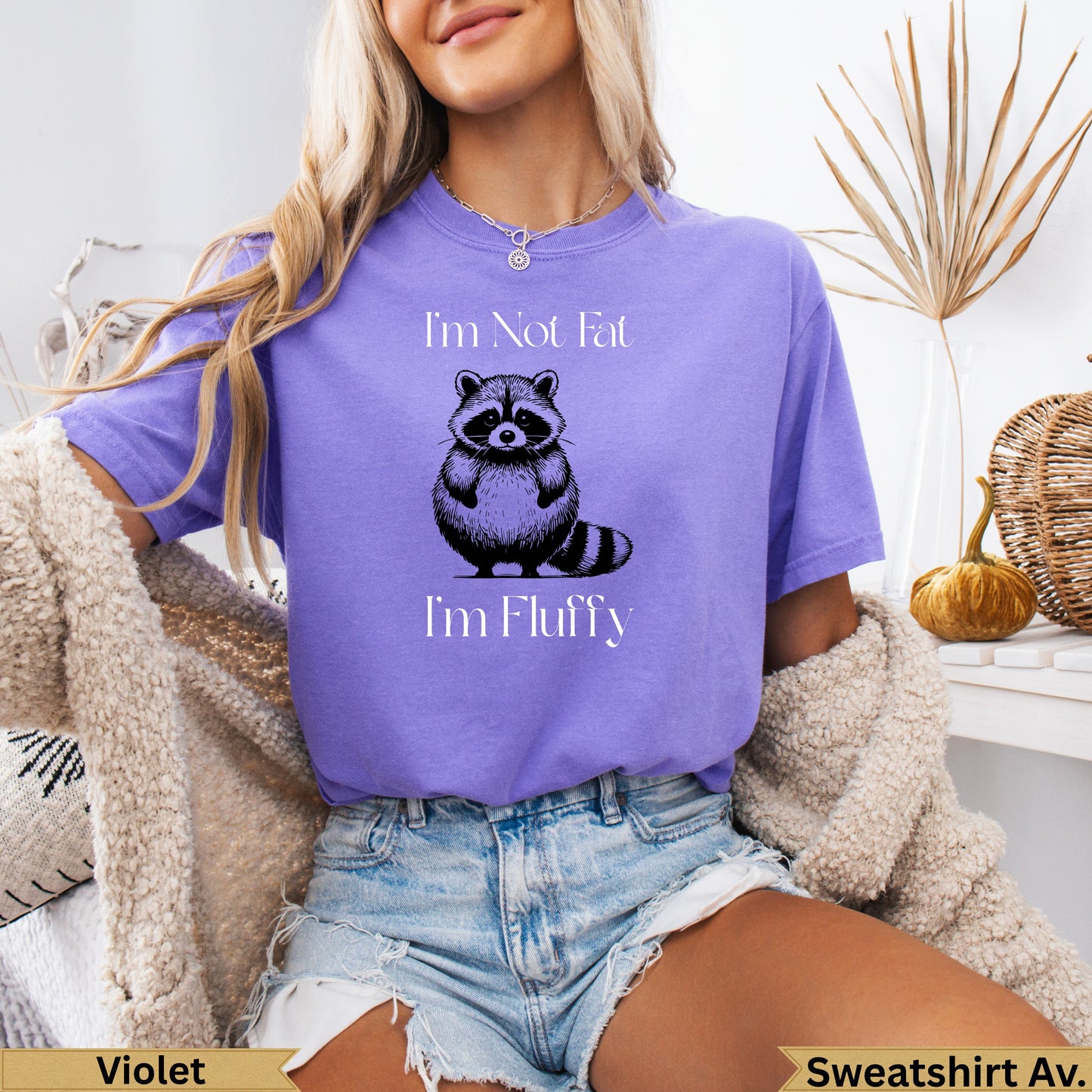 Purple t-shirt with raccoon graphic and text "I'm Not Fat I'm Fluffy".