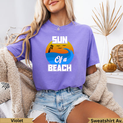 Purple t-shirt with "Sun of a Beach" text, ocean waves, and palm trees.