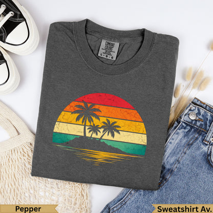 Dark grey Comfort Colors sweatshirt with vintage sunset graphic of palm trees.