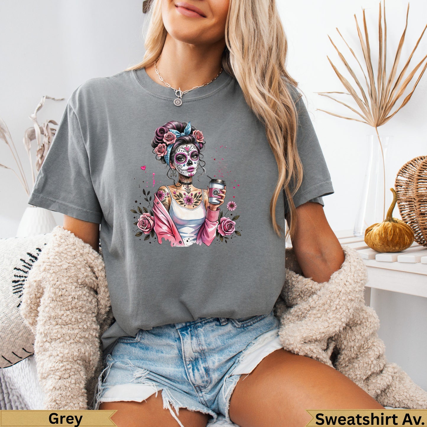 Grey t-shirt with Sugar Skull woman design holding a coffee cup.