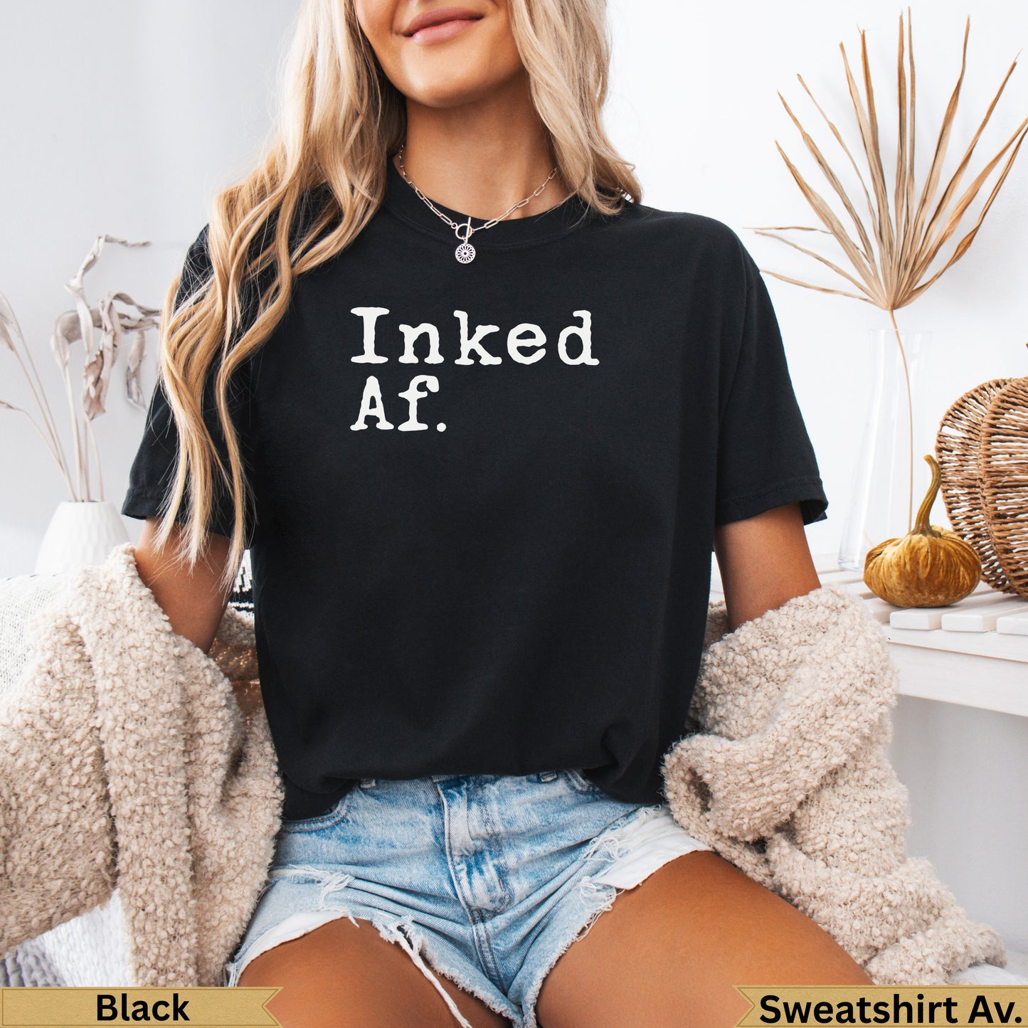 Black crewneck t-shirt with "Inked Af." text and a cozy cardigan.