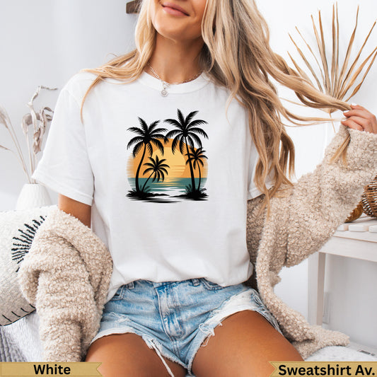 White t-shirt with sunset and palm trees graphic.