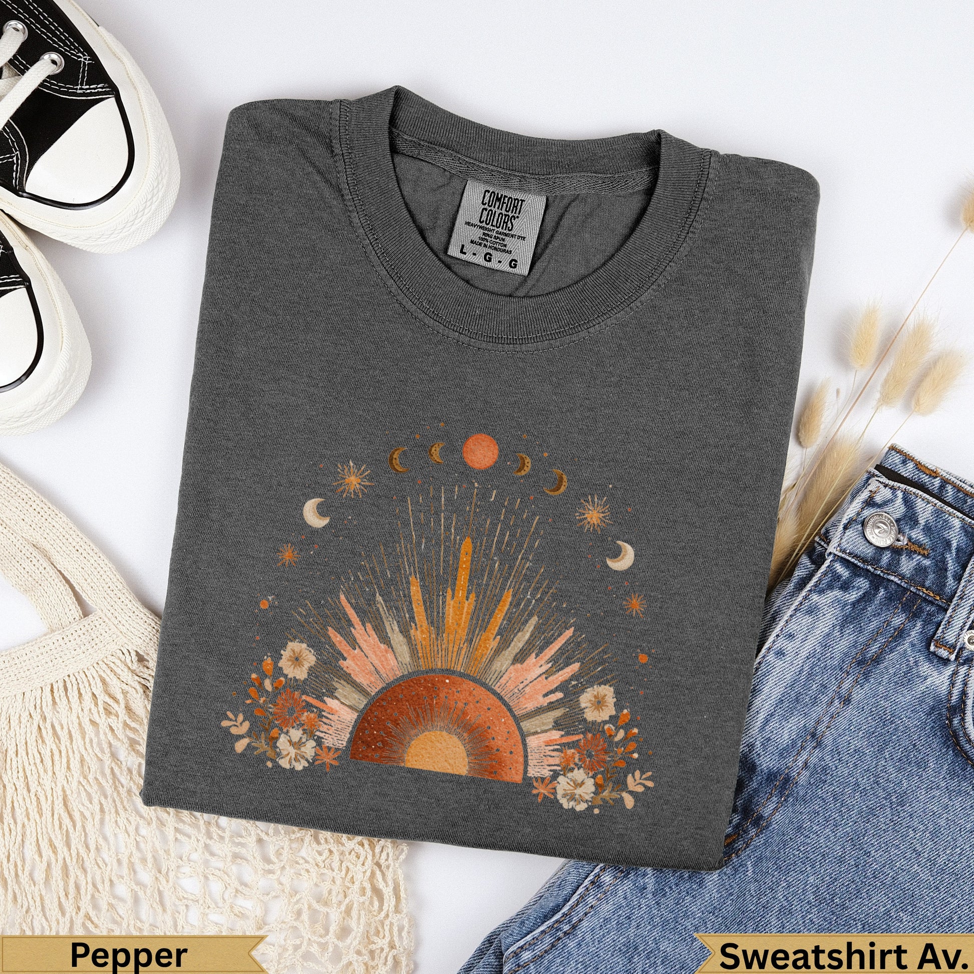 Dark gray crewneck sweatshirt with sun, moon, and floral graphic.