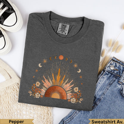 Dark gray crewneck sweatshirt with sun, moon, and floral graphic.