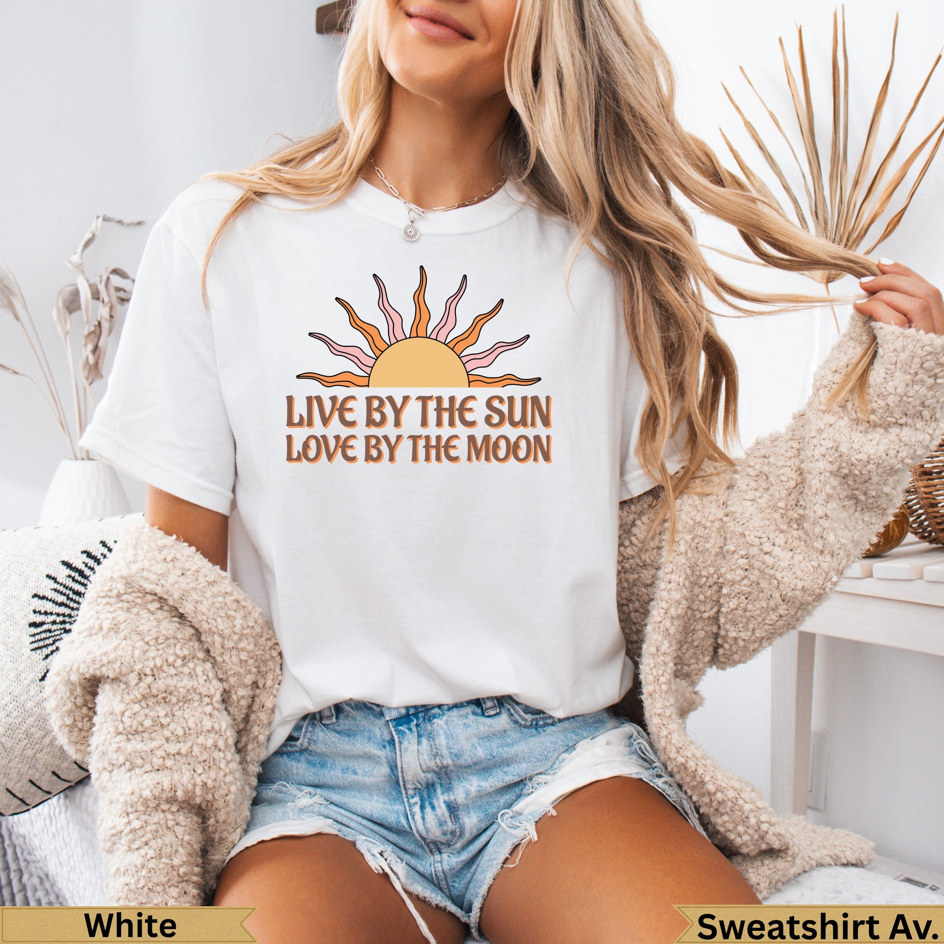 White t-shirt with sun and moon graphic and text "LIVE BY THE SUN LOVE BY THE MOON".