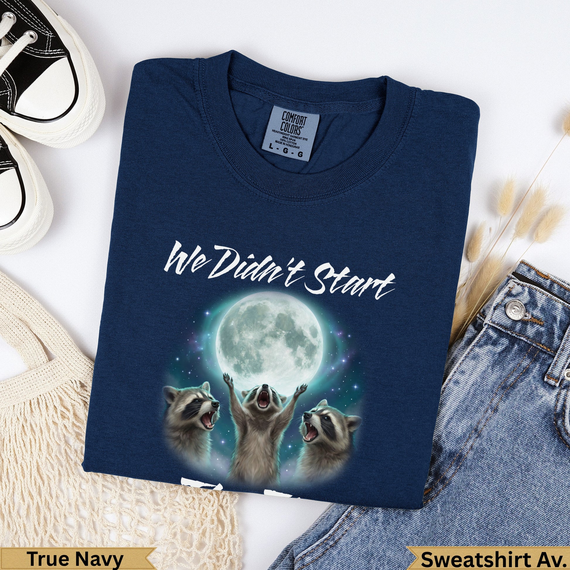 Navy sweatshirt with raccoons looking at a full moon and text "We Didn't Start".