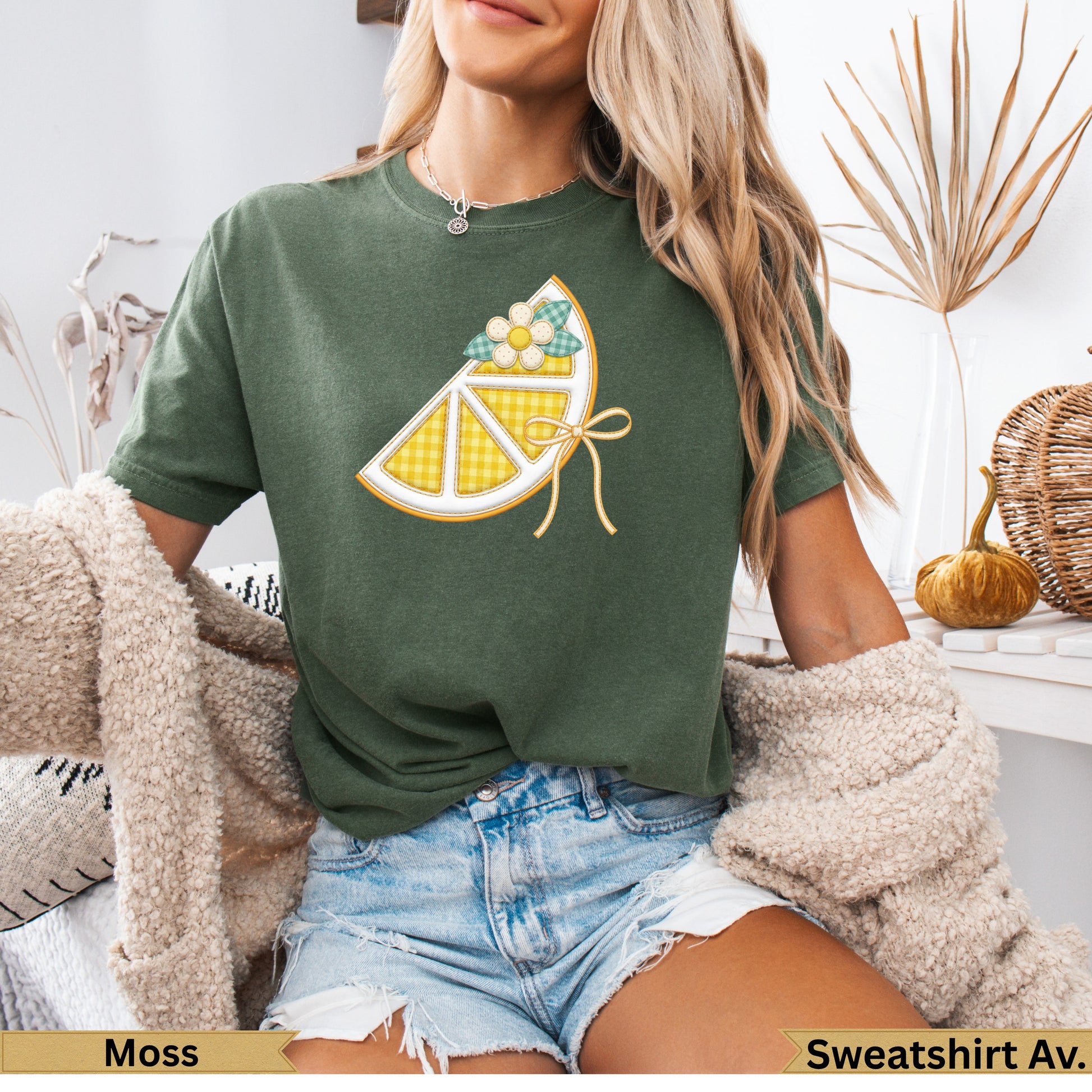 Green t-shirt with a yellow and white checkered lemon slice graphic.