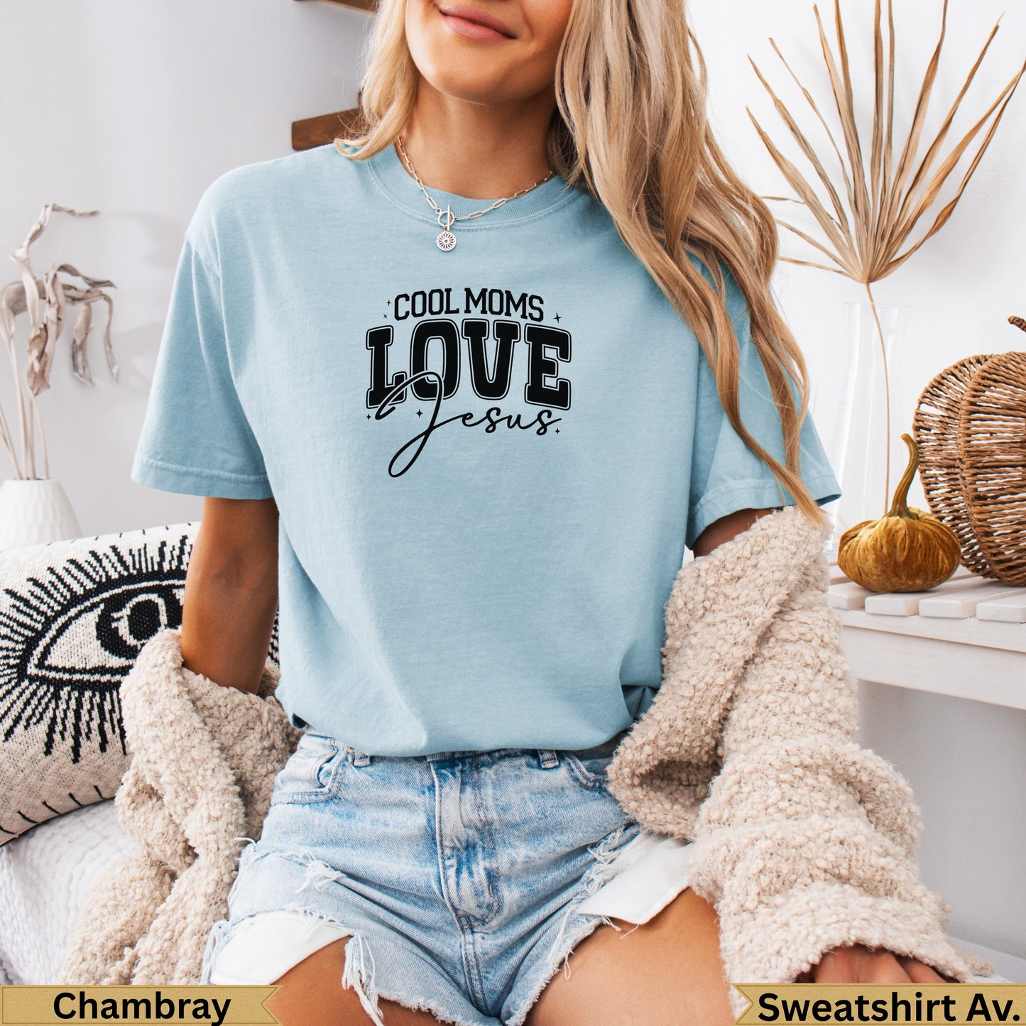 Light blue t-shirt with "Cool Moms Love Jesus" graphic, worn by a woman.