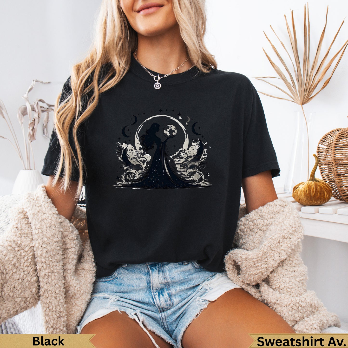 Black t-shirt with mystical moon and woman graphic.