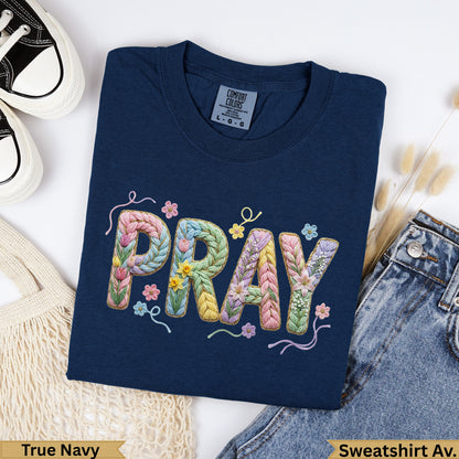 Navy sweatshirt with "PRAY" embroidered in floral, textured letters.