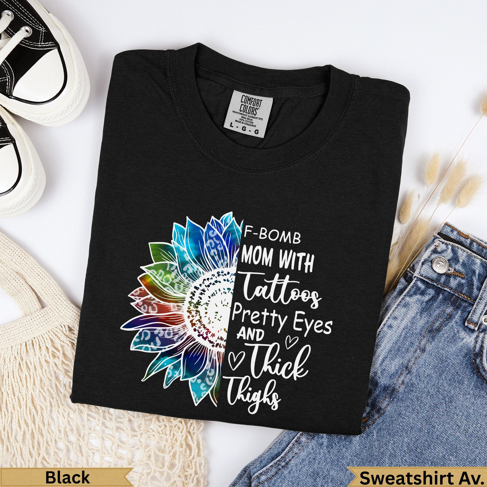 Black crewneck t-shirt with "F-Bomb Mom" sunflower graphic.