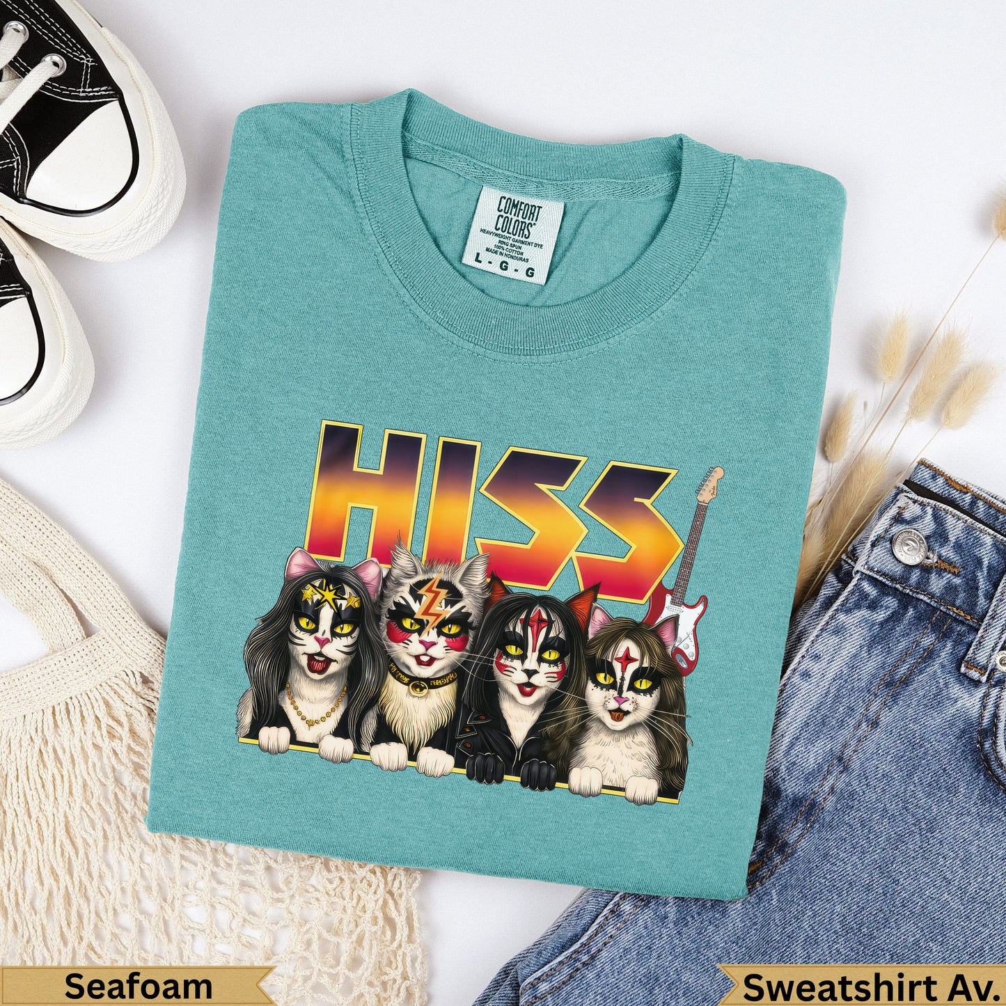Four punk rock cats with "HISS" text above on a teal Comfort Colors sweatshirt.