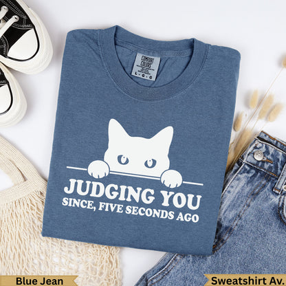 Blue Jean Comfort Colors t-shirt with cat graphic saying "Judging You Since, Five Seconds Ago".
