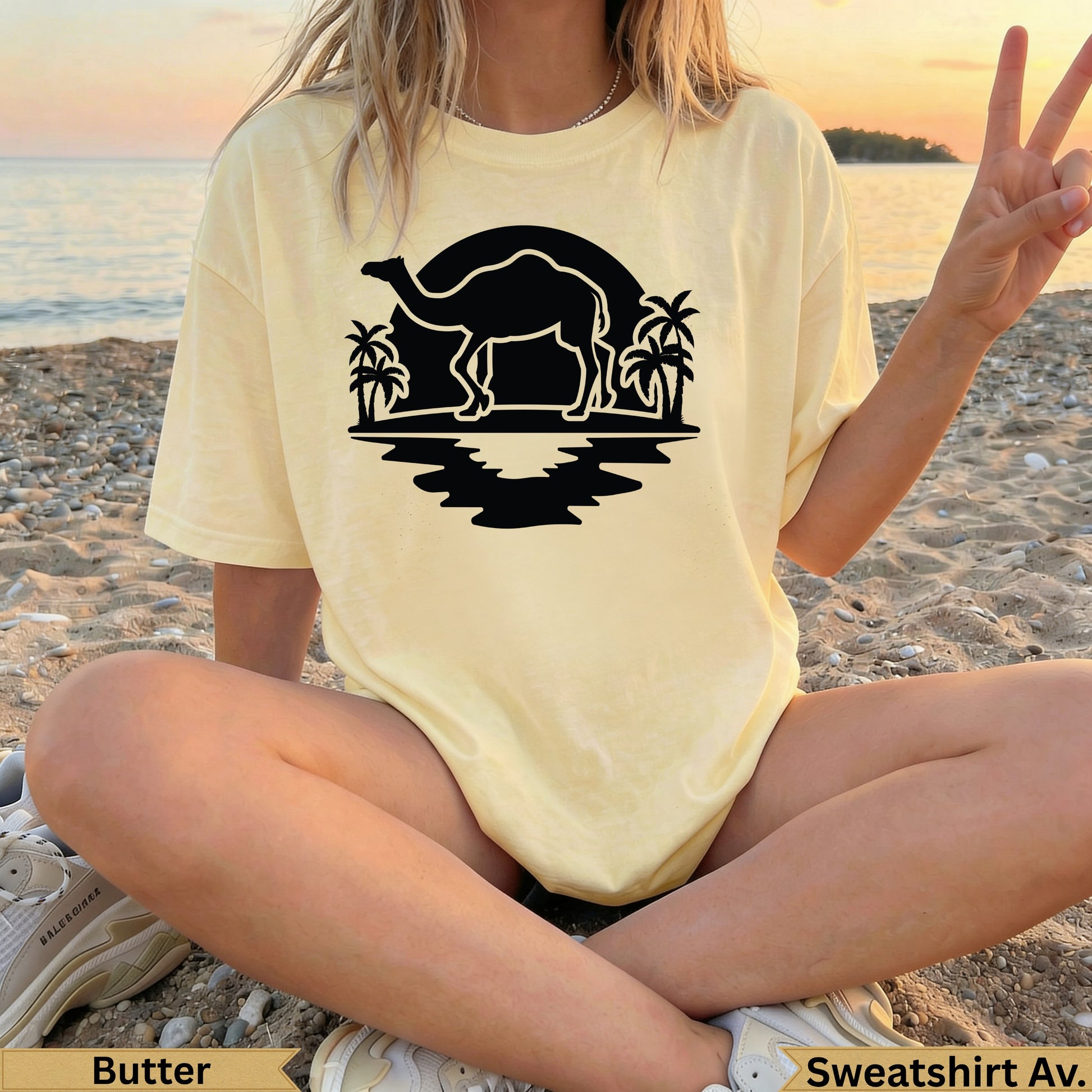 Pale yellow t-shirt with camel and palm tree silhouette design.
