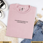 Pink Comfort Colors sweatshirt with "overstimulated and outnumbered" text.