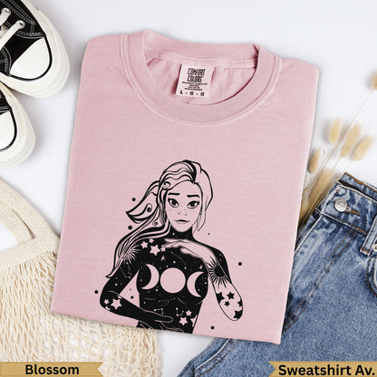 Pink Comfort Colors t-shirt with celestial woman graphic, "Blossom" and "Sweatshirt Av." text.