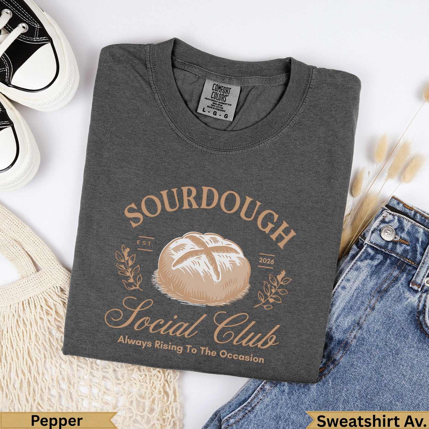 Dark gray t-shirt with "Sourdough Social Club" text and bread illustration.