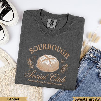 Dark gray t-shirt with "Sourdough Social Club" text and bread illustration.