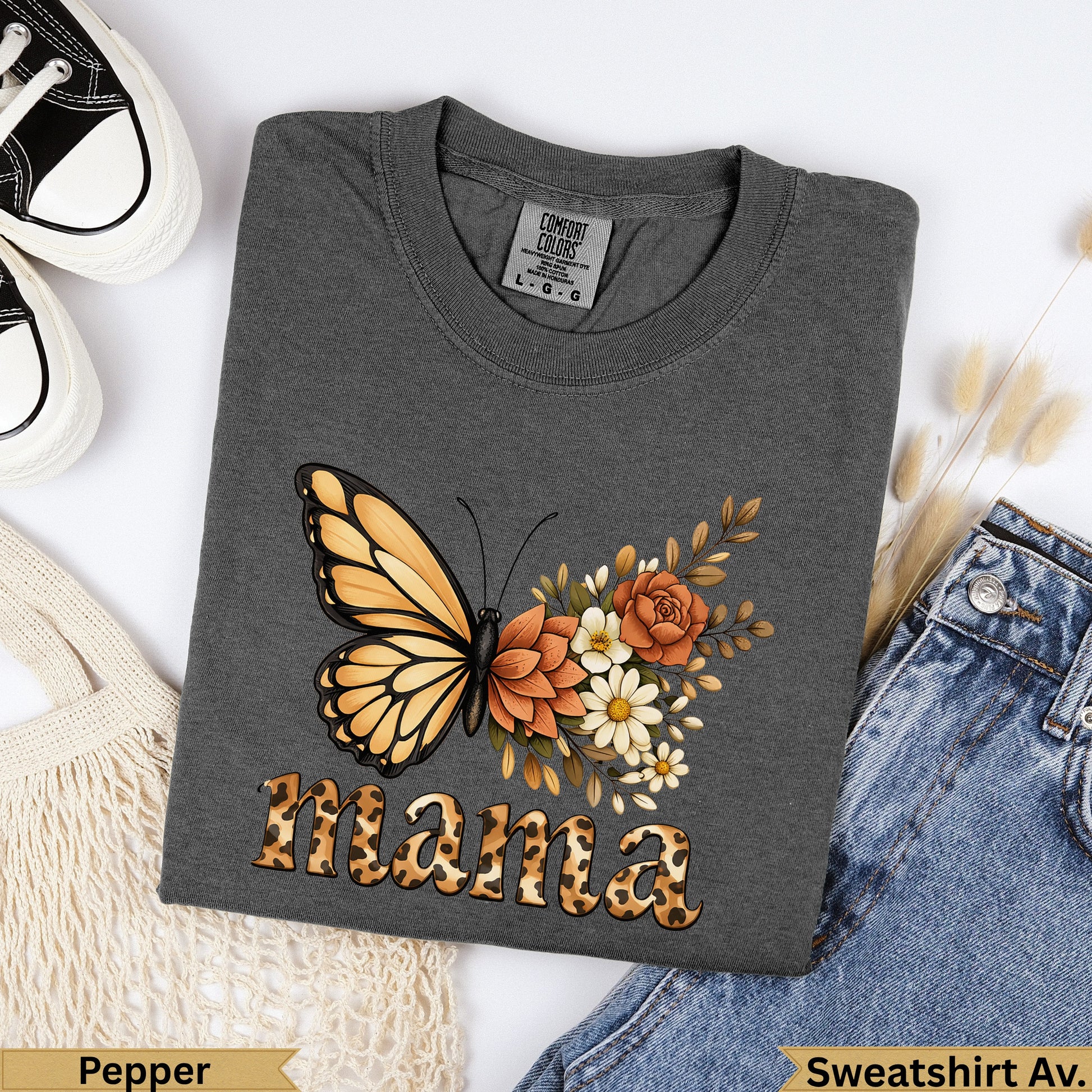 Dark grey sweatshirt with "mama" and butterfly graphic, shown with jeans.