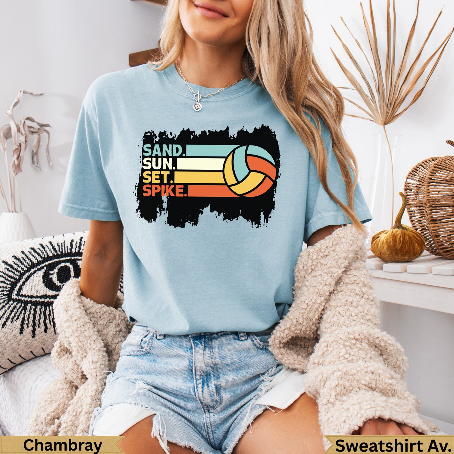 Light blue t-shirt with "SAND, SUN, SET, SPIKE" and volleyball graphic.