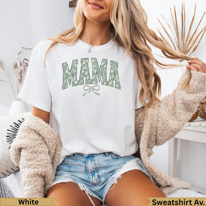 White t-shirt with "MAMA" floral print and green bow graphic.