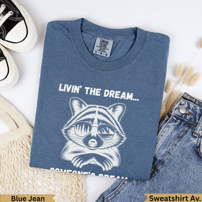 Raccoon wearing sunglasses with "Livin' the Dream" text, Comfort Colors shirt.