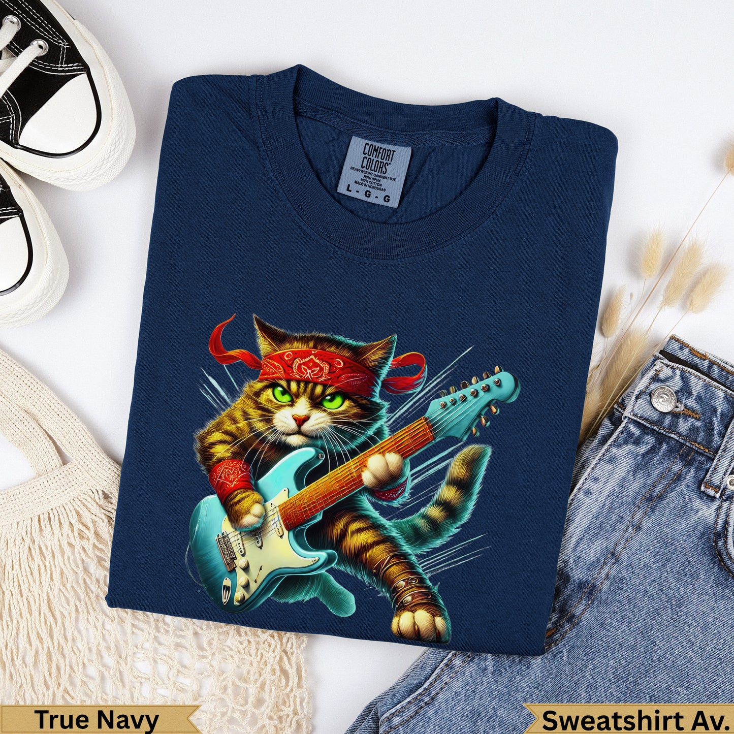 Tabby cat wearing bandana and playing electric guitar, true navy sweatshirt.