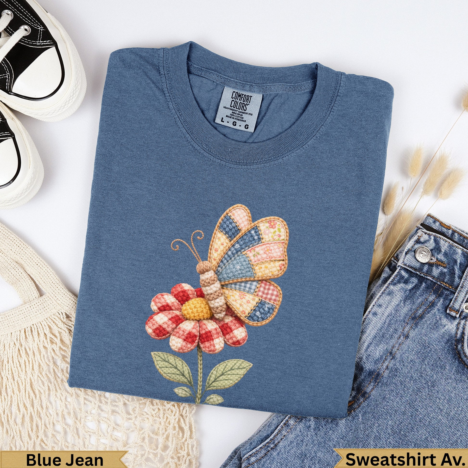 Blue Jean Comfort Colors sweatshirt with a patchwork butterfly and flower design.