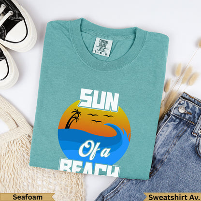 Teal t-shirt with "SUN Of a BEACH" text and a sunset graphic.