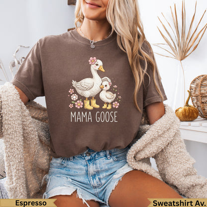 Mama Goose graphic on a brown t-shirt with geese and flowers.