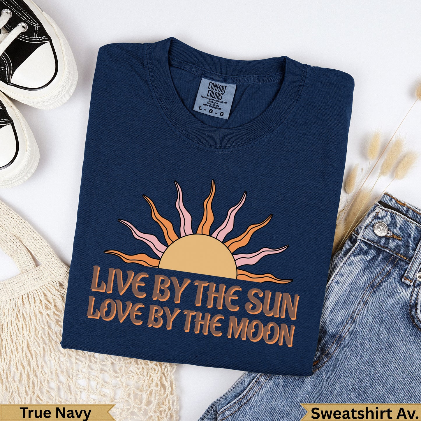 Navy blue t-shirt with "Live by the Sun, Love by the Moon" graphic.