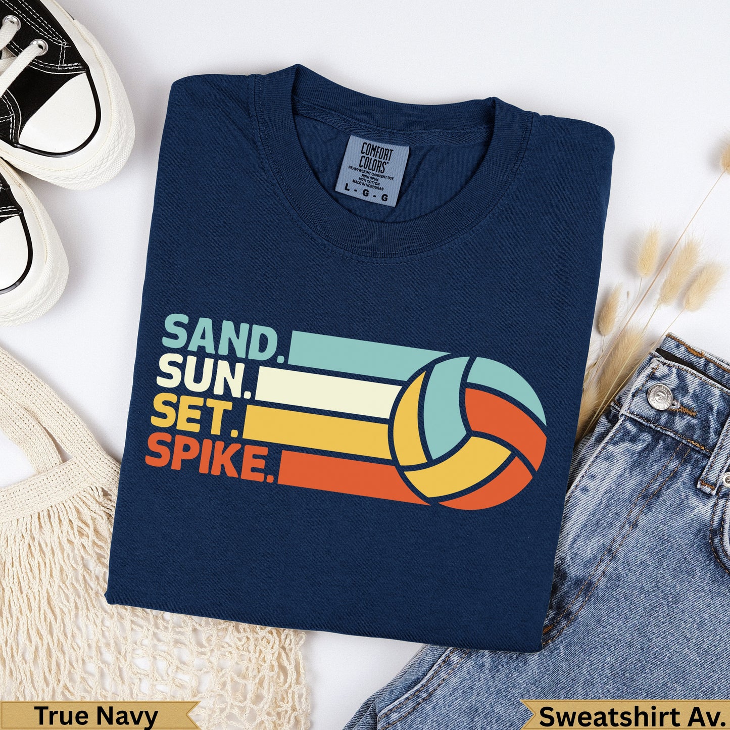Navy t-shirt with "Sand. Sun. Set. Spike." and volleyball graphic.