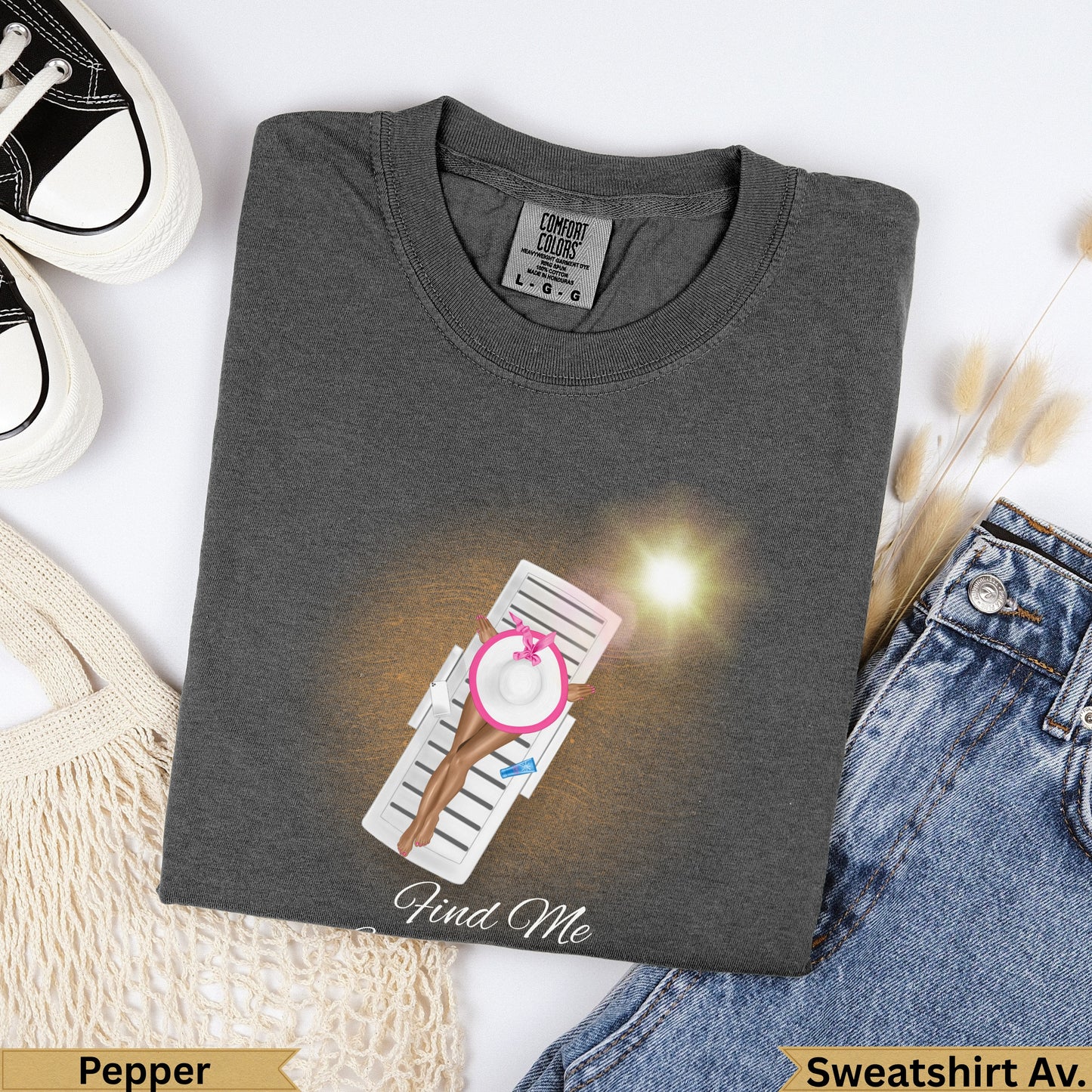 Charcoal grey t-shirt with a woman on a lounge chair, "Find Me" text.