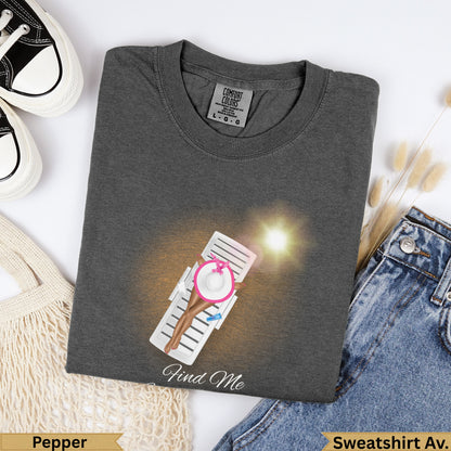 Charcoal grey t-shirt with a woman on a lounge chair, "Find Me" text.