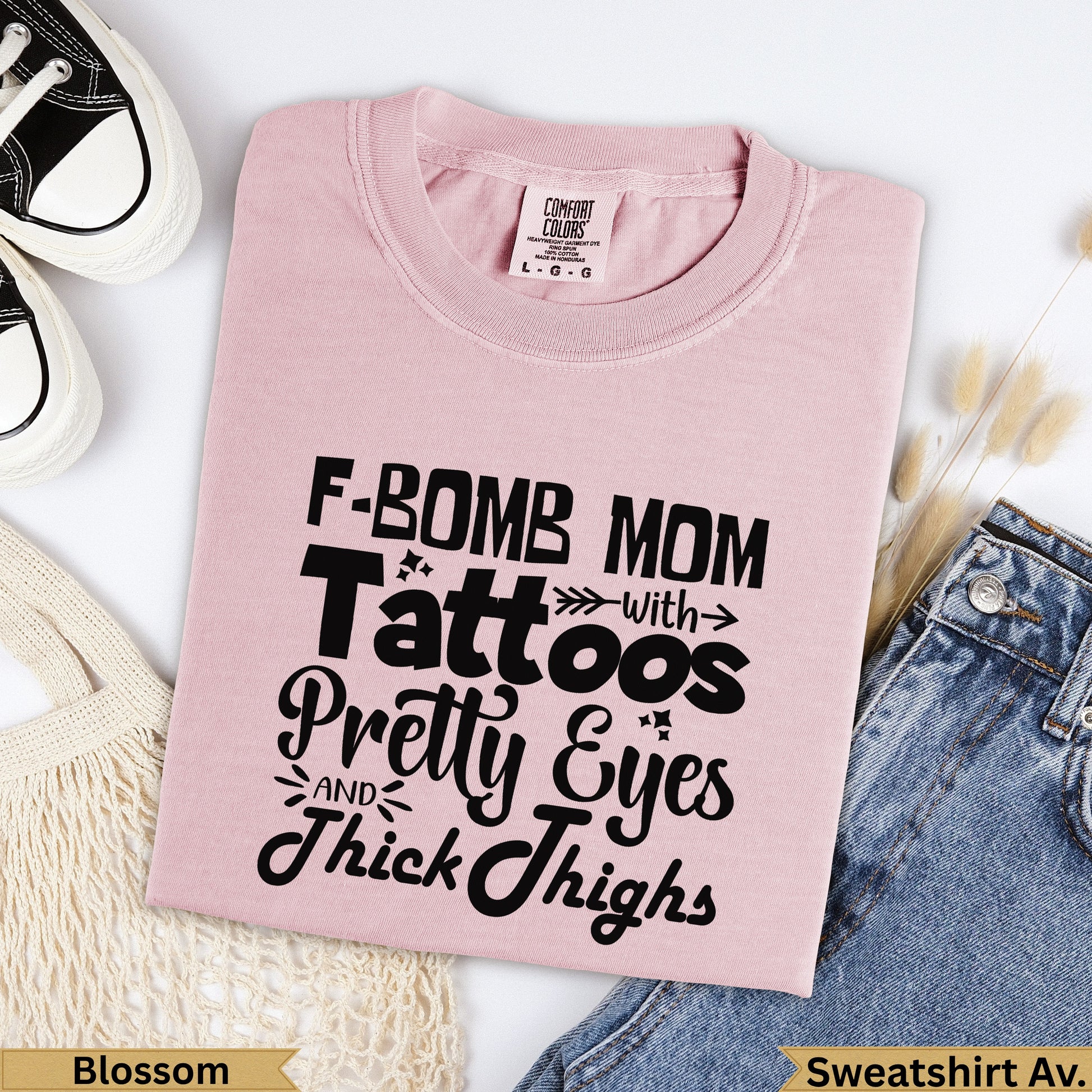 Pink Comfort Colors sweatshirt with "F-BOMB MOM" graphic.
