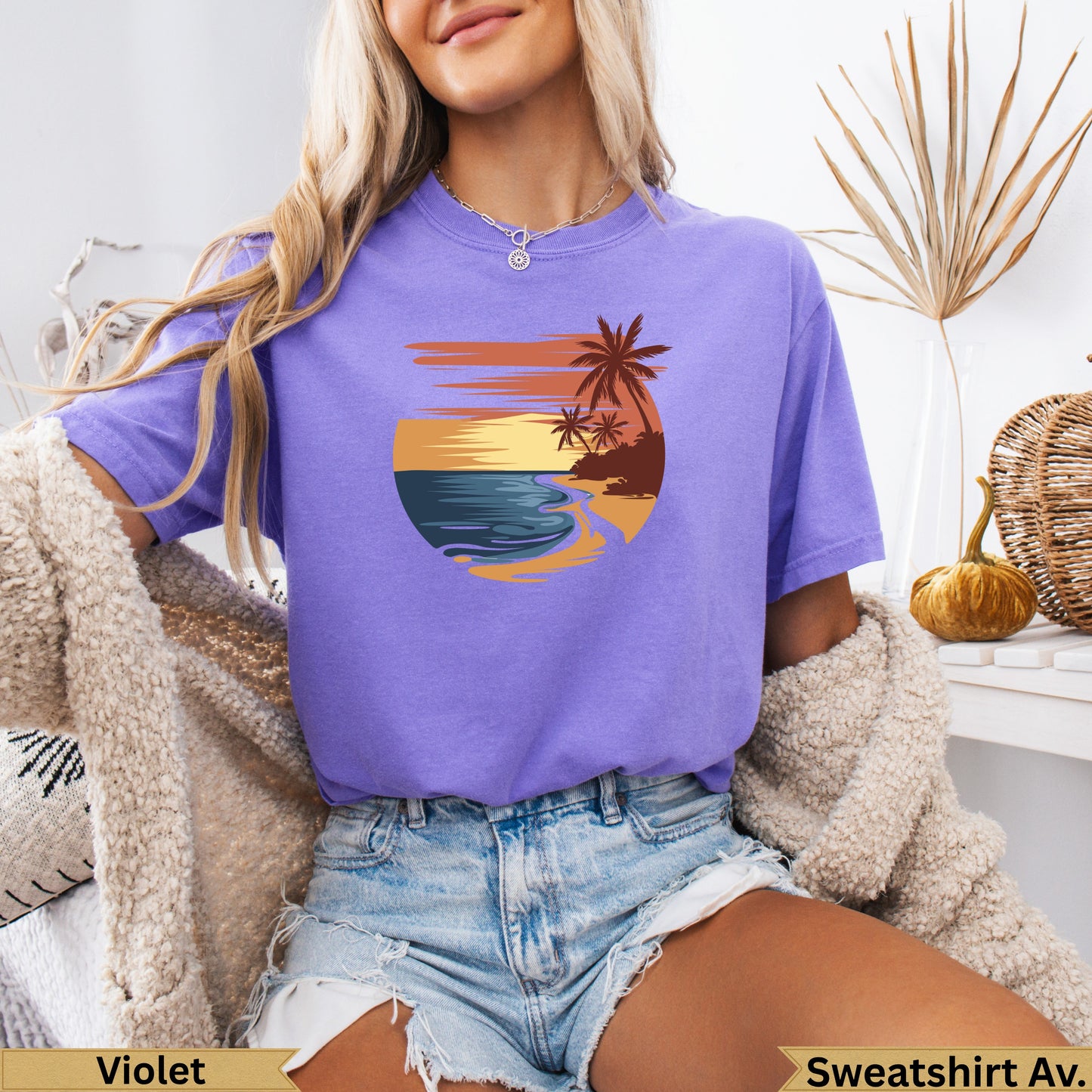 Purple t-shirt with a stylized beach sunset graphic and "Violet" and "Sweatshirt Av." text.