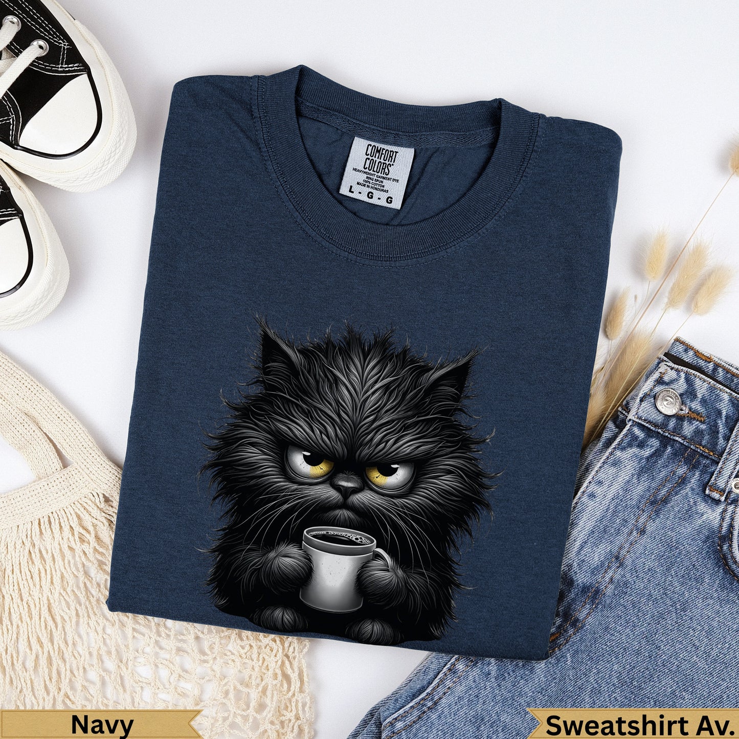 Dark navy Comfort Colors sweatshirt with grumpy black cat holding coffee mug.