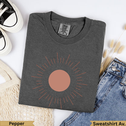 Dark grey Comfort Colors sweatshirt with sun graphic, size L.