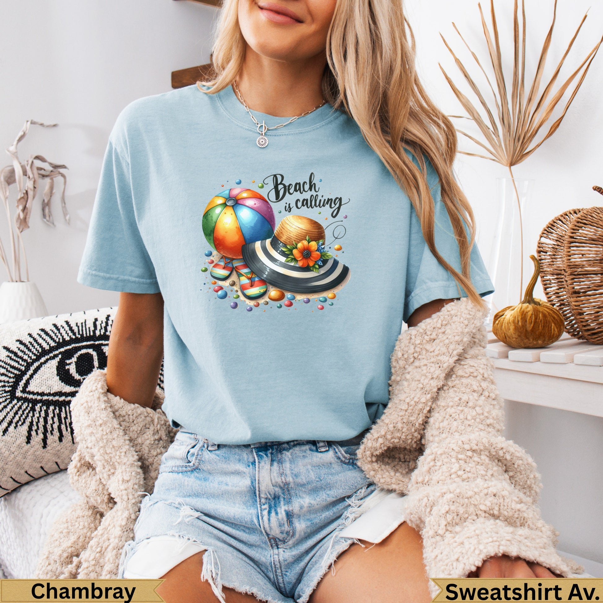 Light blue t-shirt with beach ball, hat, and colorful beads graphic.