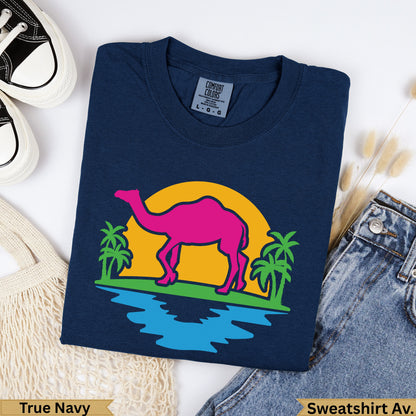 Navy t-shirt with hot pink camel and palm trees at sunset graphic.