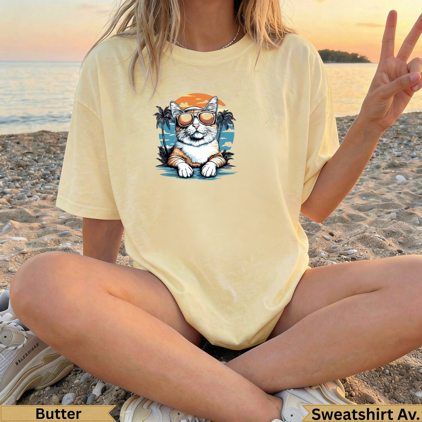 Yellow t-shirt with a cat wearing sunglasses and palm trees graphic.