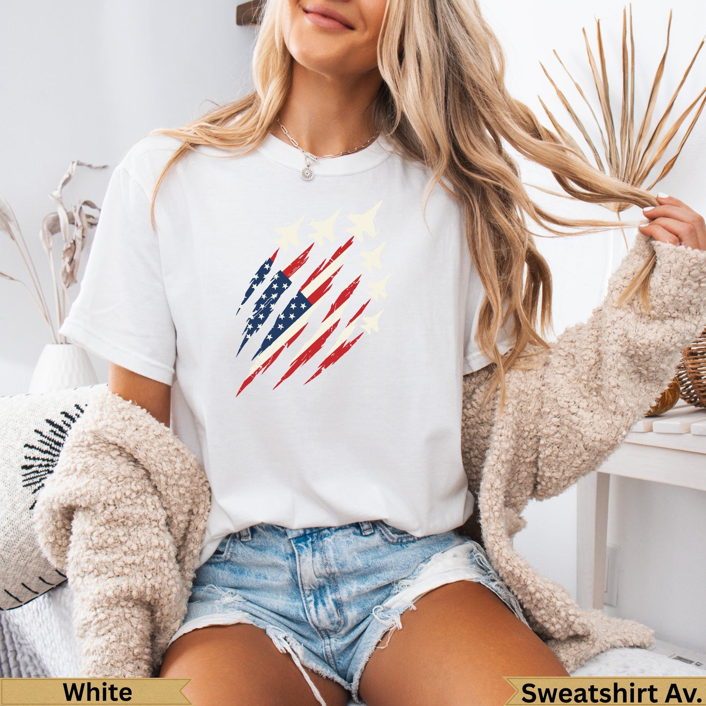 White t-shirt with distressed American flag and fighter jets graphic.