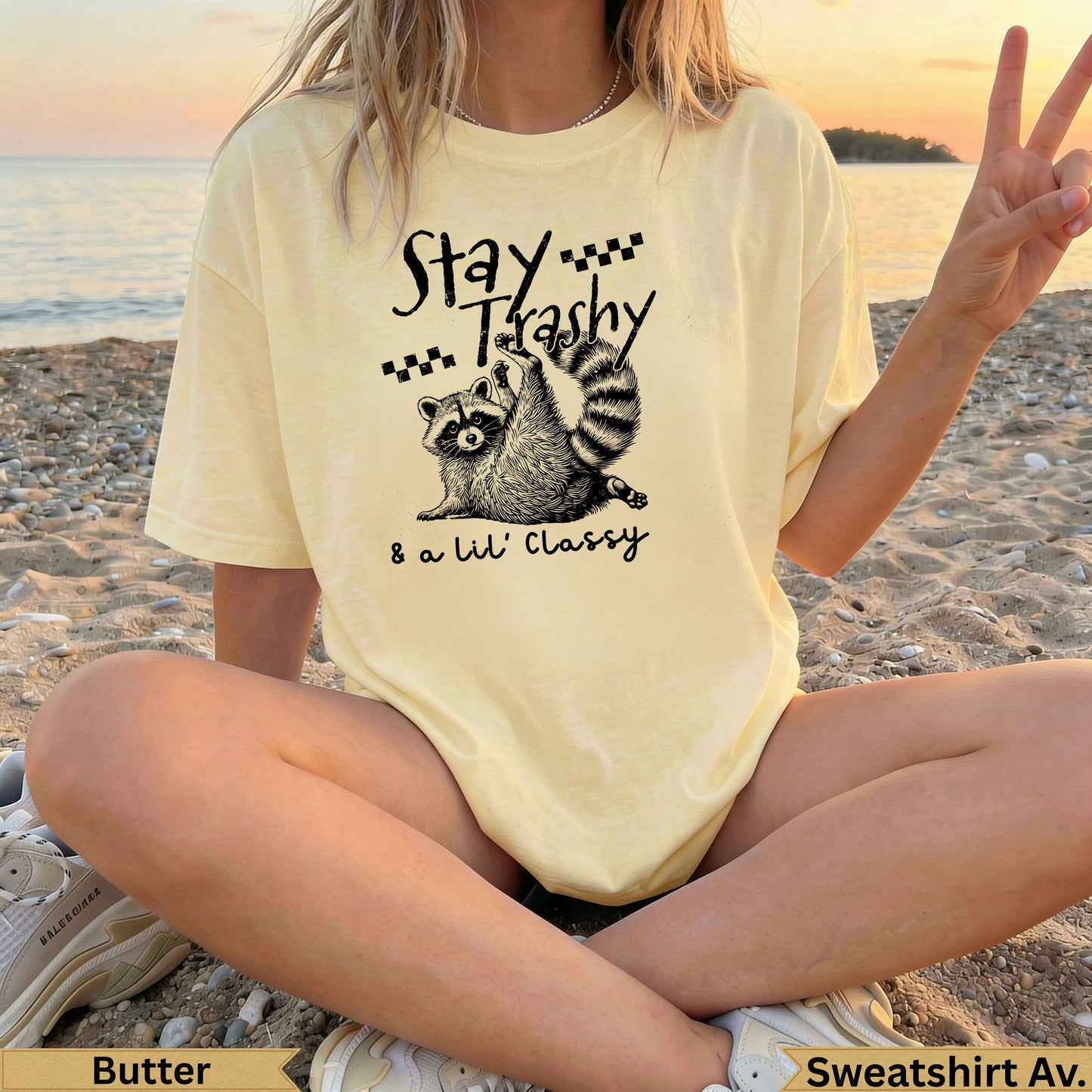 Yellow t-shirt with raccoon and "Stay Trashy & a lil' Classy" text.